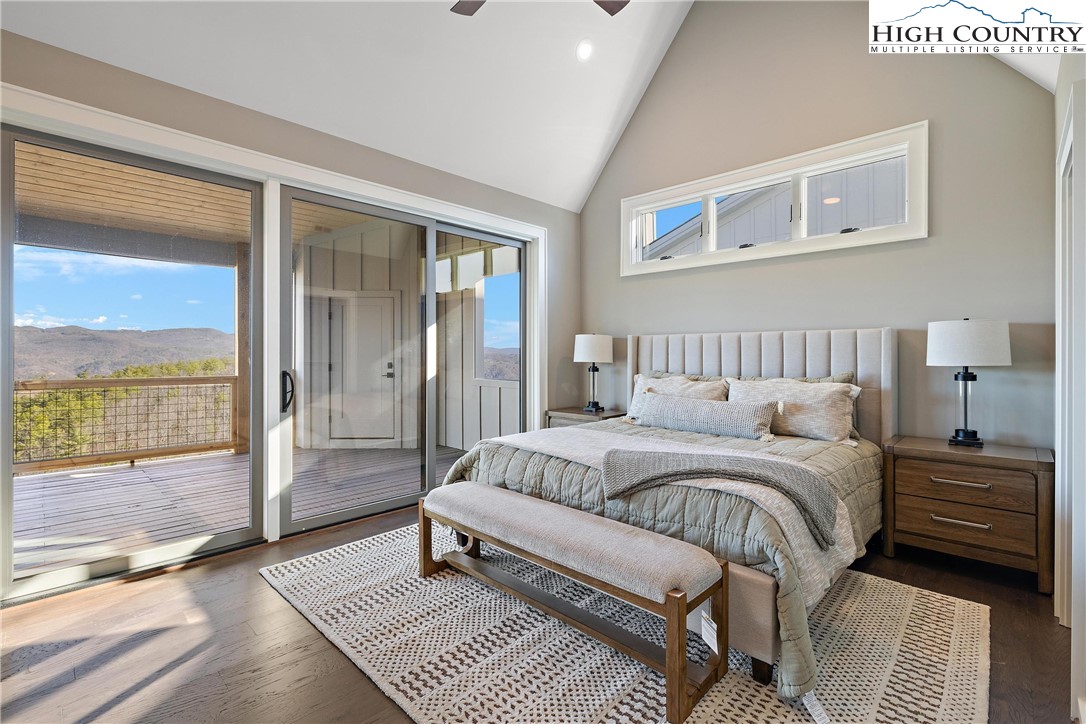 150 Calico Court Boone, NC 28607 - Photo 21 of 50 a bedroom with a bed and a night stand