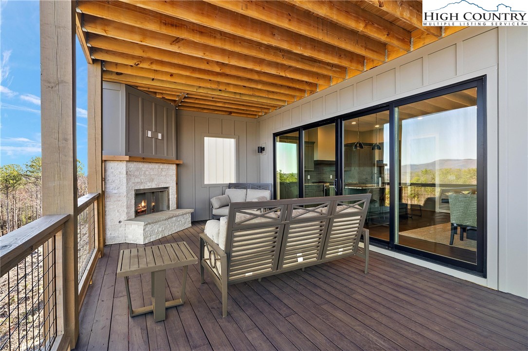 150 Calico Court Boone, NC 28607 - Photo 24 of 50 a view of living room kitchen with furniture and wooden floor