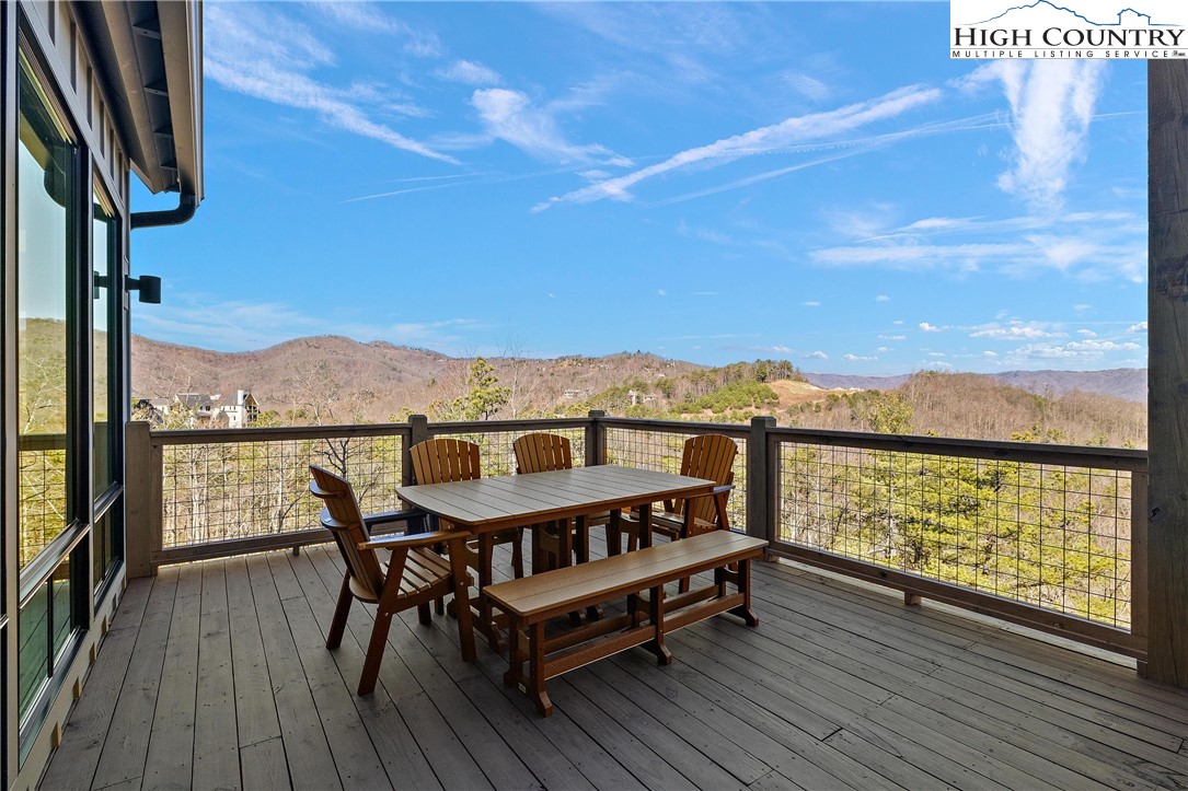 150 Calico Court Boone, NC 28607 - Photo 25 of 50 a view of a balcony with wooden floor and outdoor seating