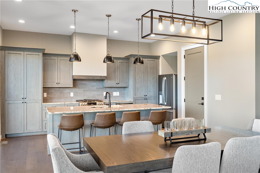 150 Calico Court Boone, NC 28607 - Photo 5 of 50 a kitchen with stainless steel appliances granite countertop a sink and cabinets