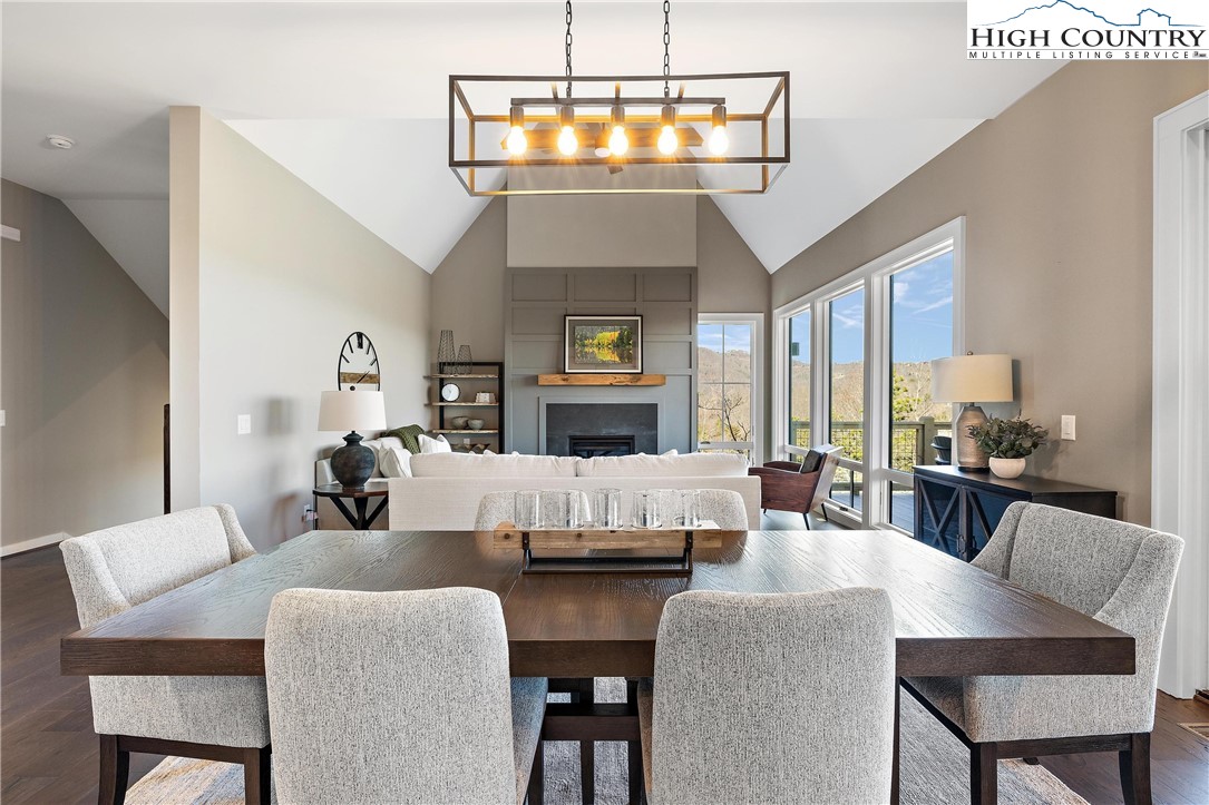 150 Calico Court Boone, NC 28607 - Photo 7 of 50 a living room with fireplace furniture and a chandelier