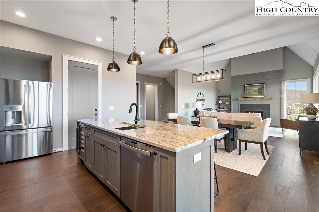 150 Calico Court Boone, NC 28607 - Photo 8 of 50 a large kitchen with a table and chairs