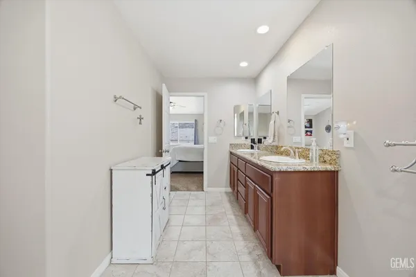 a view of a storage and utility room with washer and dryer