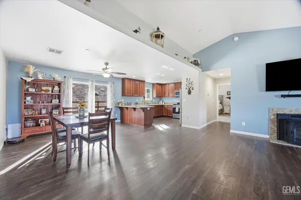 a view of a dining room with furniture and wooden floor