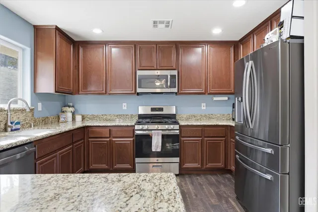 a kitchen with a stove and a sink