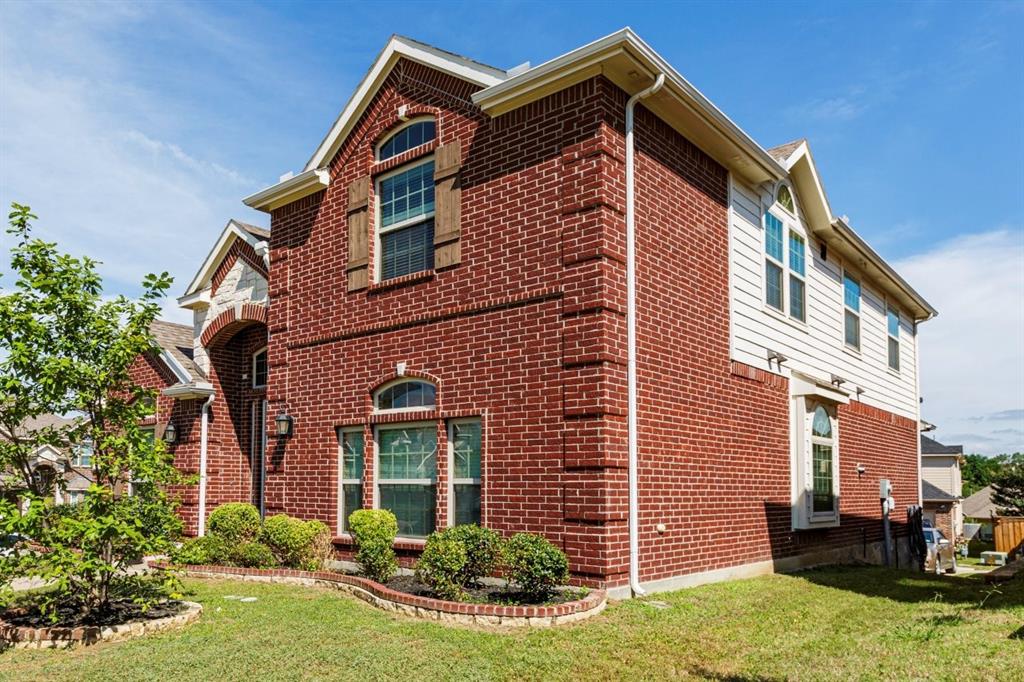 1522 Blue Jay Road Garland, TX 75043 - Photo 3 of 32 Brick and siding exterior featuring arched window accents and decorative shutters