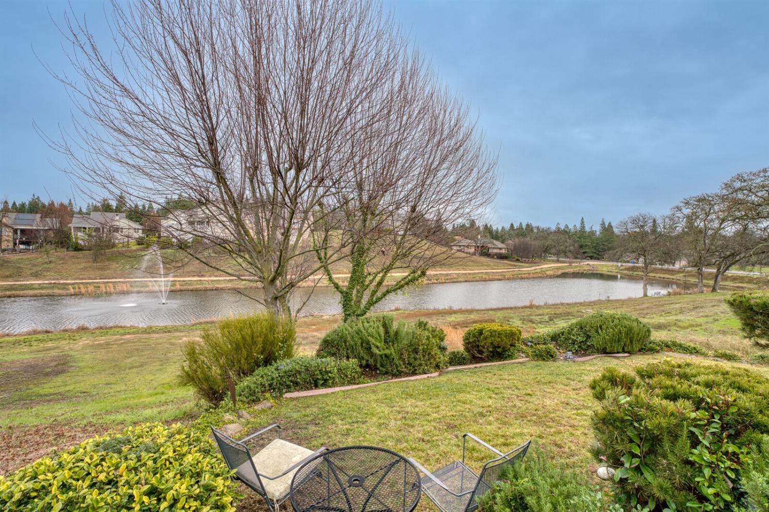 a view of a lake with a yard