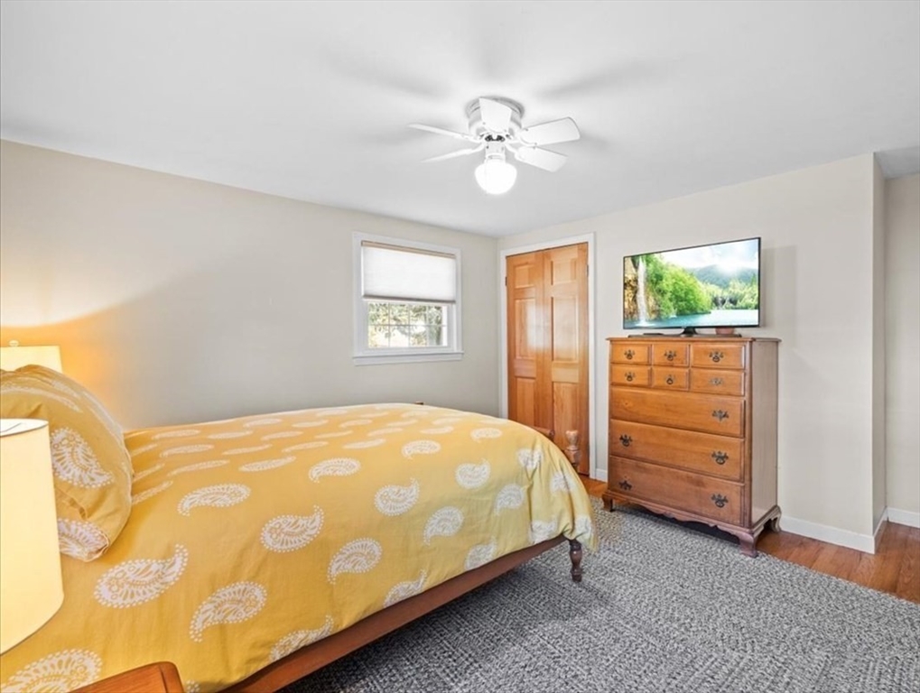 261 Emmett Street Fall River, MA 02721 - Photo 26 of 40 a bedroom with a bed and a dresser