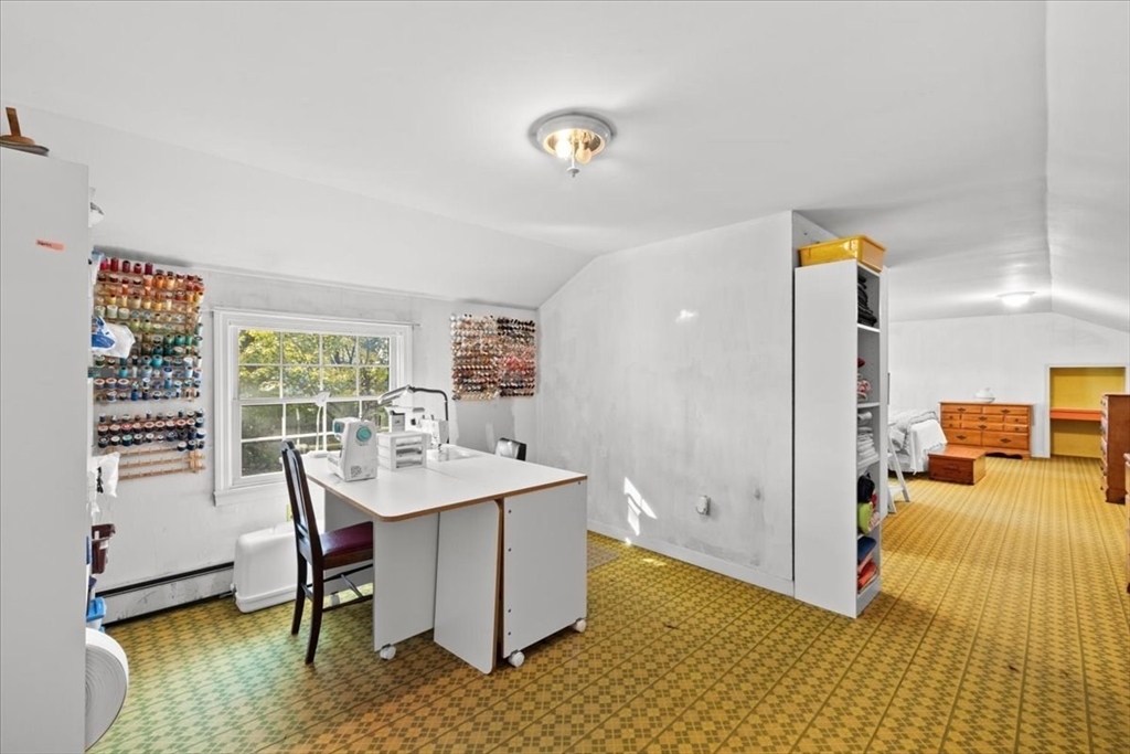 261 Emmett Street Fall River, MA 02721 - Photo 32 of 40 a view of a workspace with furniture and a window