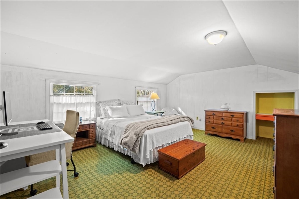 261 Emmett Street Fall River, MA 02721 - Photo 33 of 40 a bedroom with a bed and a dresser in it