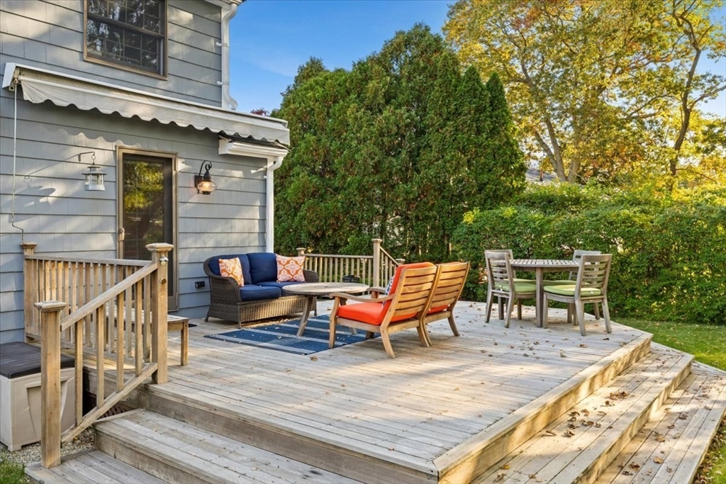 261 Emmett Street Fall River, MA 02721 - Photo 7 of 40 a backyard of a house with barbeque oven table and chairs