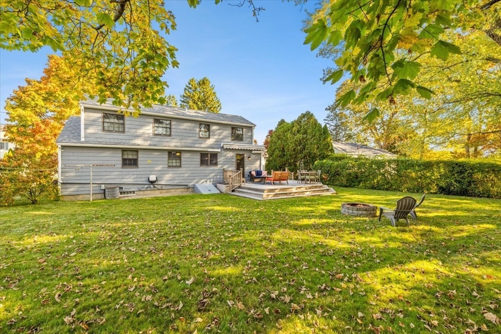 261 Emmett Street Fall River, MA 02721 - Photo 10 of 40 a view of a swimming pool with a lawn chairs and plants
