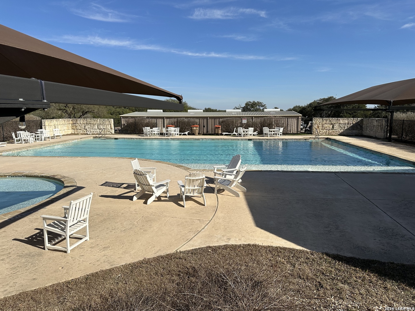 116 Ephram Mclane Blanco, TX 78606 - Photo 11 of 16 a view of a swimming pool and lounge chairs
