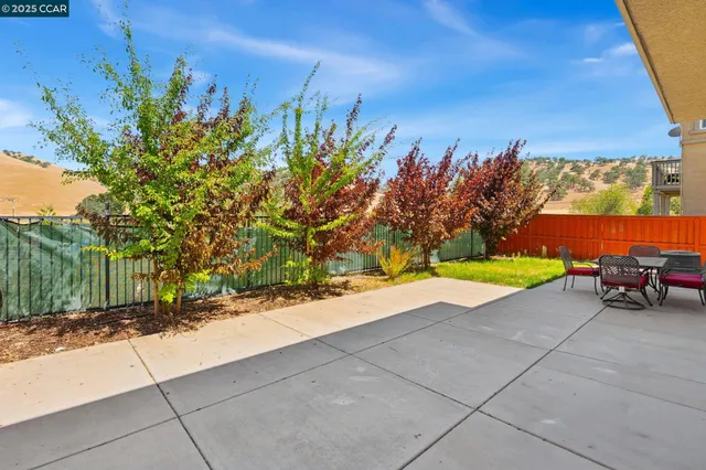 a view of a yard with an outdoor space
