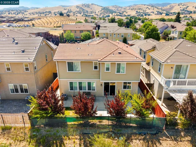 an aerial view of a house with a lake view