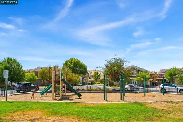 a view of a park with swings and slides
