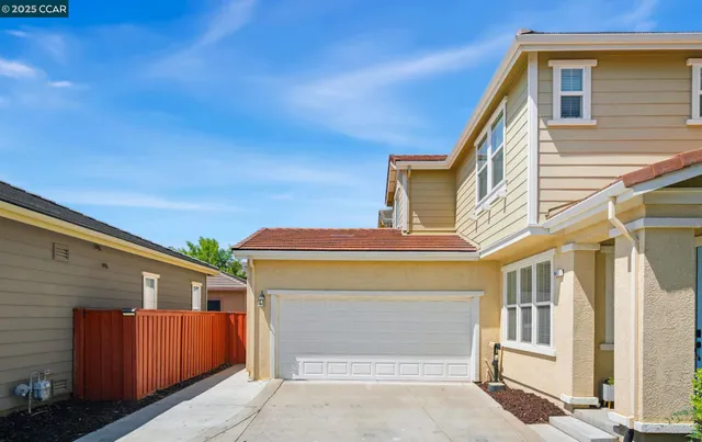a front view of a house with a garage