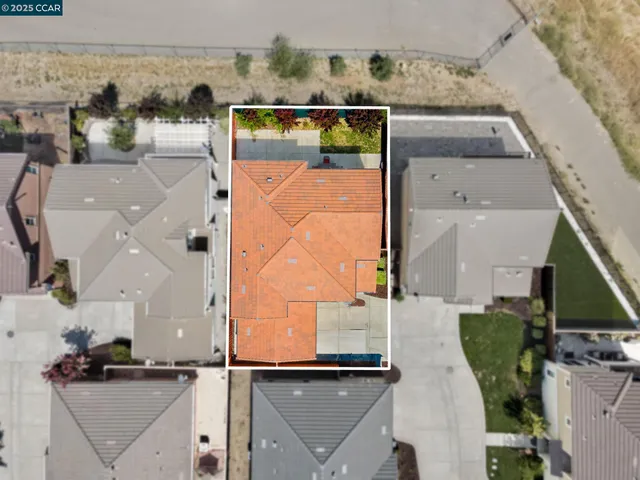 an aerial view of houses with outdoor space