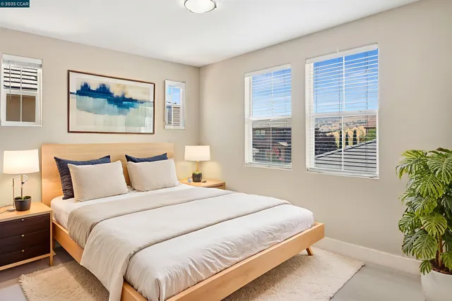 a bedroom with bed and a window