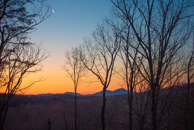 a view of mountain with a yard