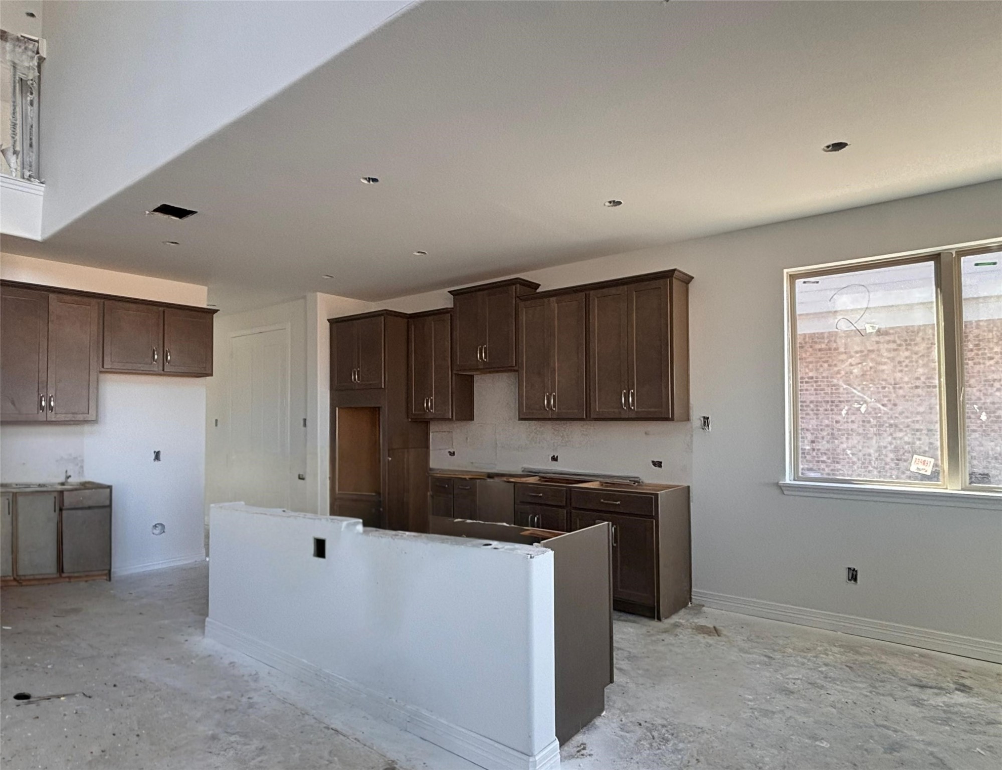 7822 Jasper Meadows Way Angleton, TX 77515 - Photo 20 of 33 a kitchen that has a sink and a stove in it