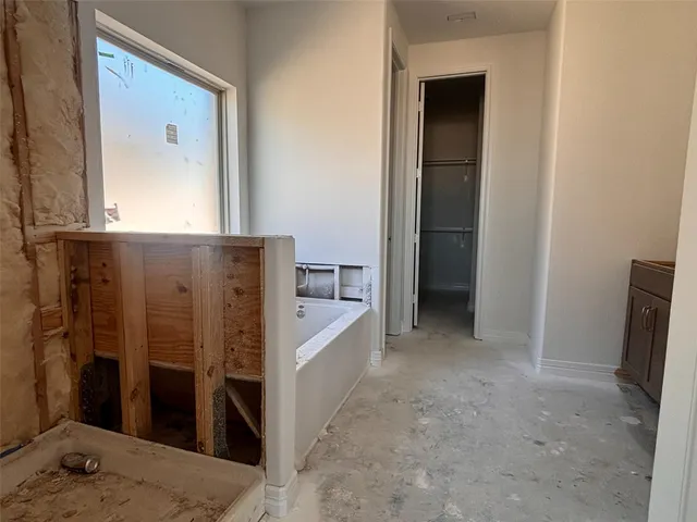 a view of a hallway with entryway door