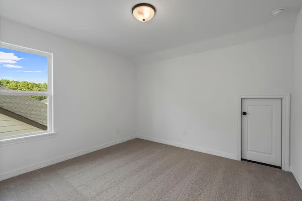 a view of an empty room and window