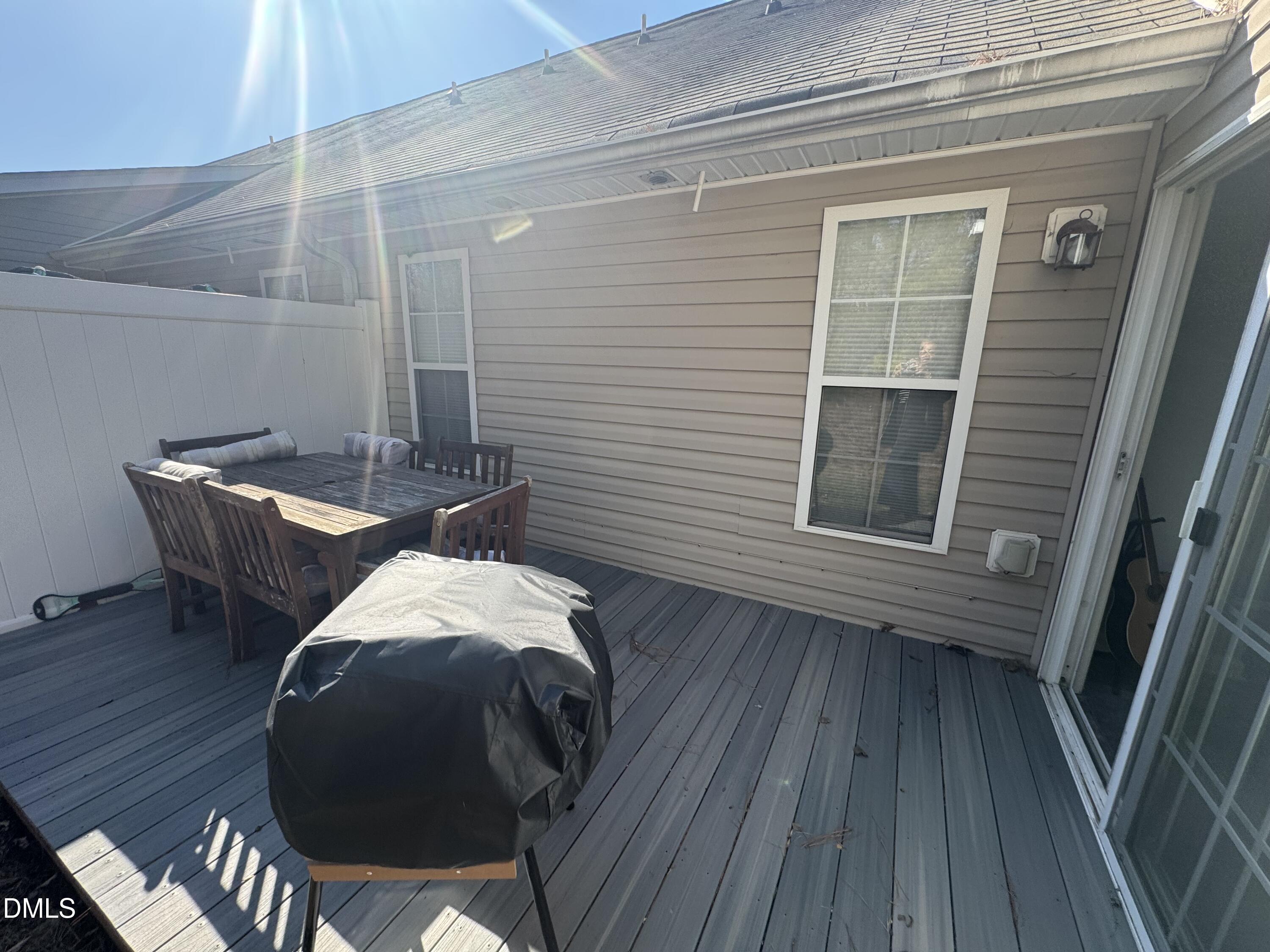 11351 Clubhaven Place, Unit 100 Raleigh, NC 27617 - Photo 27 of 29 a balcony with table and chairs