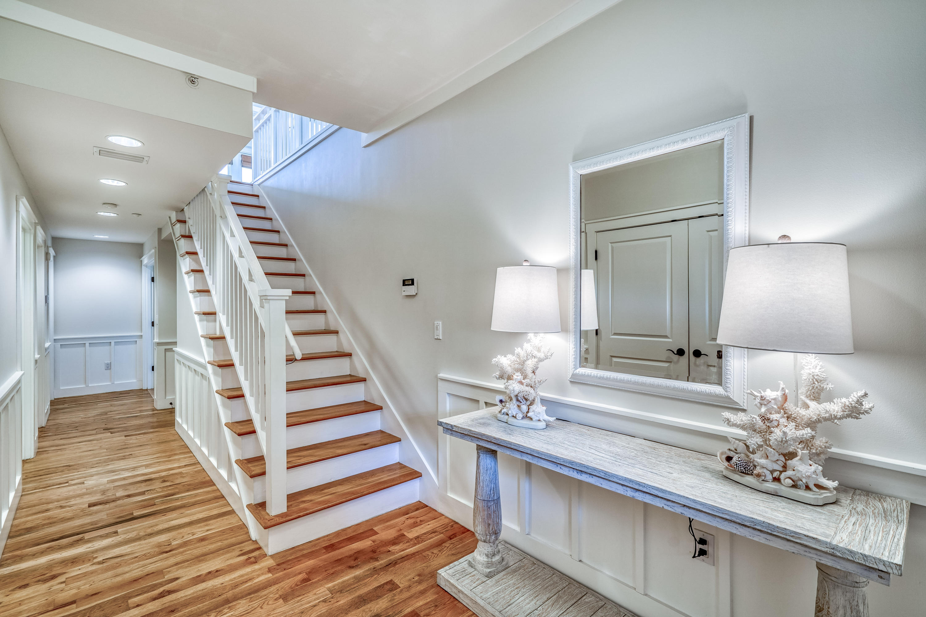 100 South Bridge Lane, Unit C111 Inlet Beach, FL 32461 - Photo 7 of 47 a view of a bedroom with wooden floor and stairs