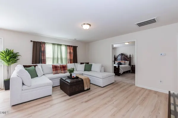 a living room with furniture and a large window