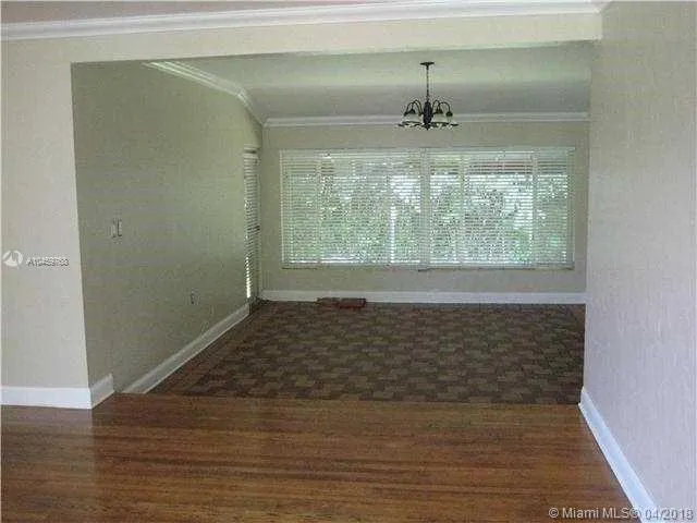 a view of an empty room and window