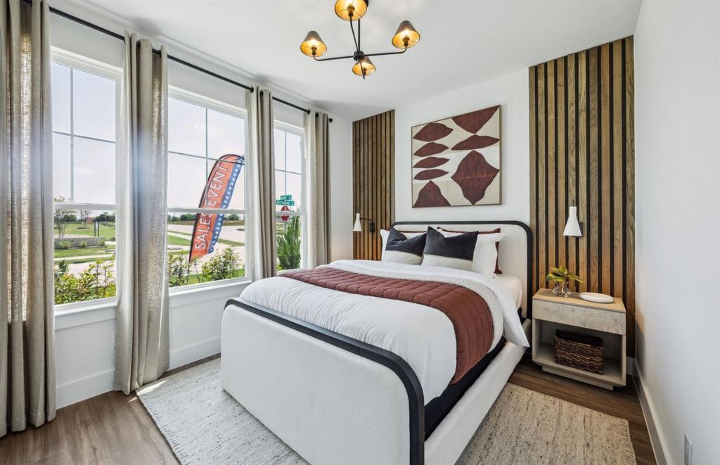 5948 Hodgkin Avenue Pilot Point, TX 76258 - Photo 13 of 15 Spacious secondary bedroom with large windows *Model Representation*