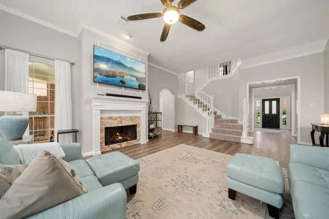 a living room with furniture and a fireplace