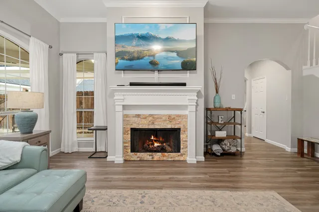 a living room with furniture and a fireplace