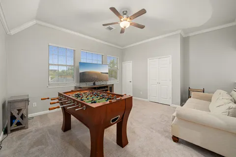 a bedroom with furniture and a window