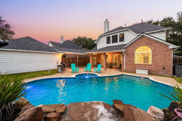 a view of a house with a swimming pool