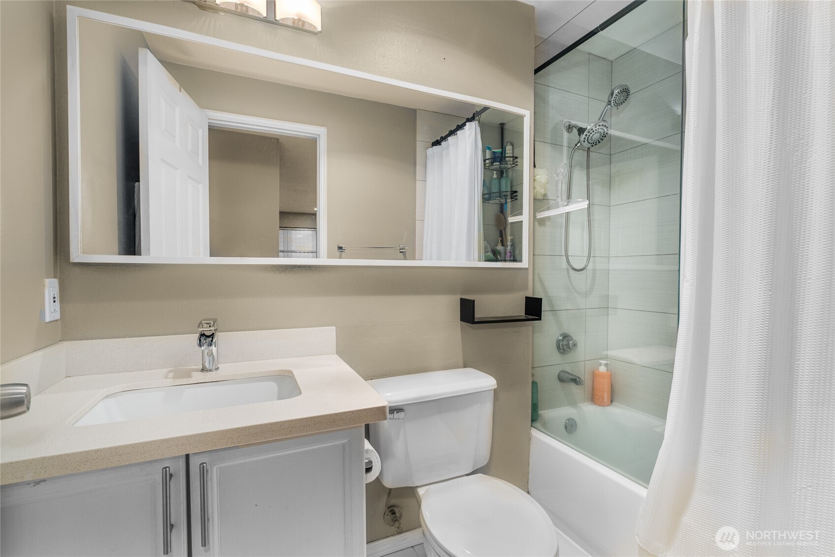15615 Waynita Way Northeast, Unit B303 Bothell, WA 98011 - Photo 12 of 30 a bathroom with a sink toilet and shower