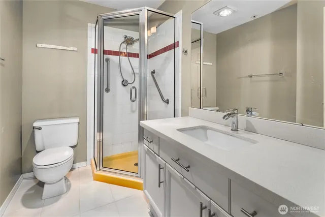 a bathroom with a sink toilet and shower