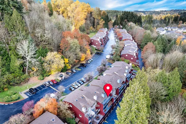 an aerial view of a house with a lake view