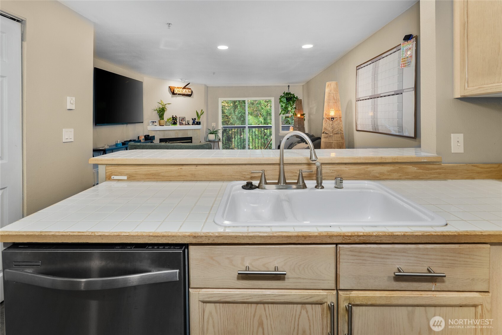 15615 Waynita Way Northeast, Unit B303 Bothell, WA 98011 - Photo 8 of 30 a kitchen with kitchen island a sink appliances and cabinets