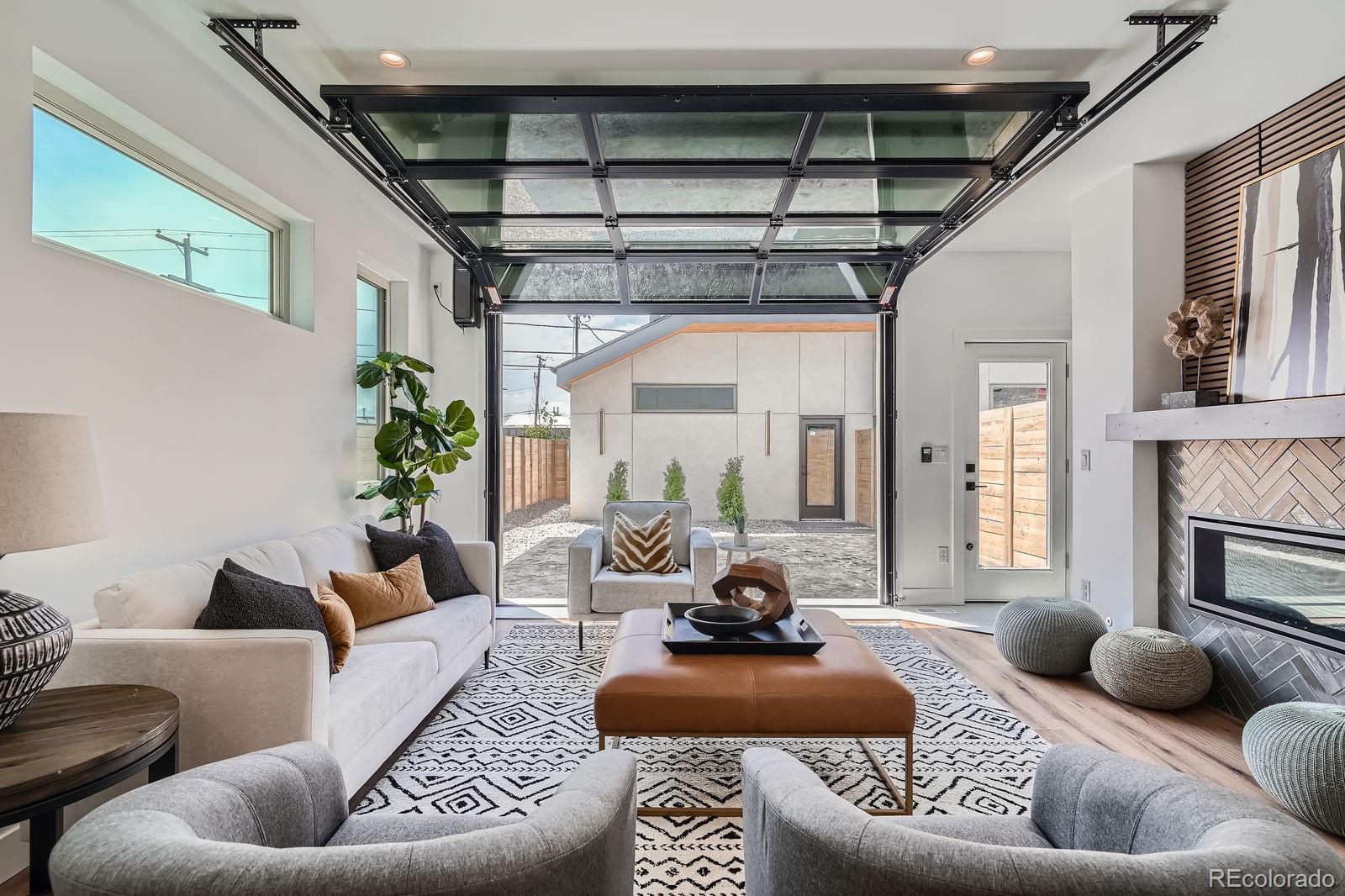 4474 Utica Street Denver, CO 80212 - Photo 16 of 40 a living room with furniture and a fireplace