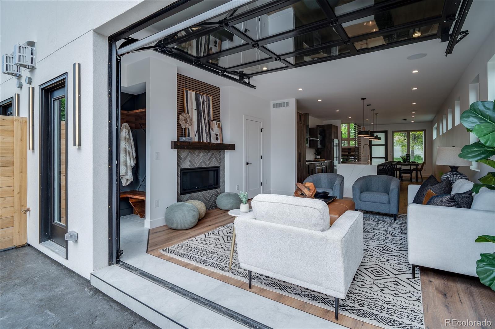 4474 Utica Street Denver, CO 80212 - Photo 17 of 40 a living room with furniture and a fireplace