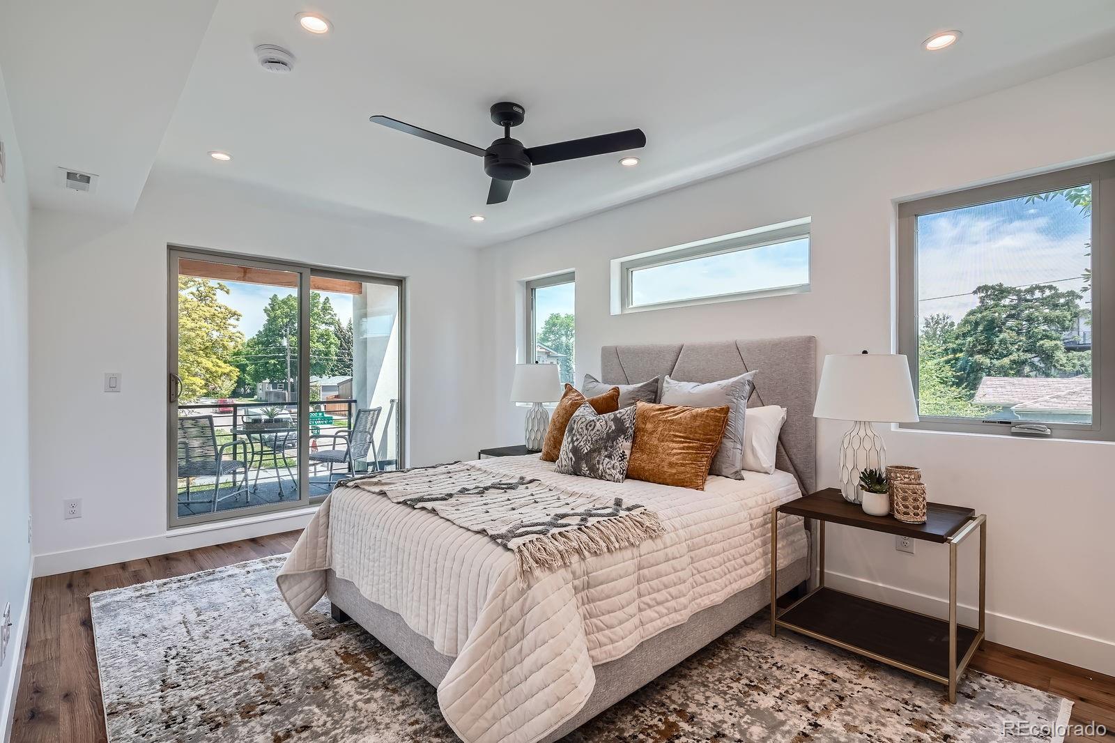 4474 Utica Street Denver, CO 80212 - Photo 18 of 40 a bedroom with a large bed and a window