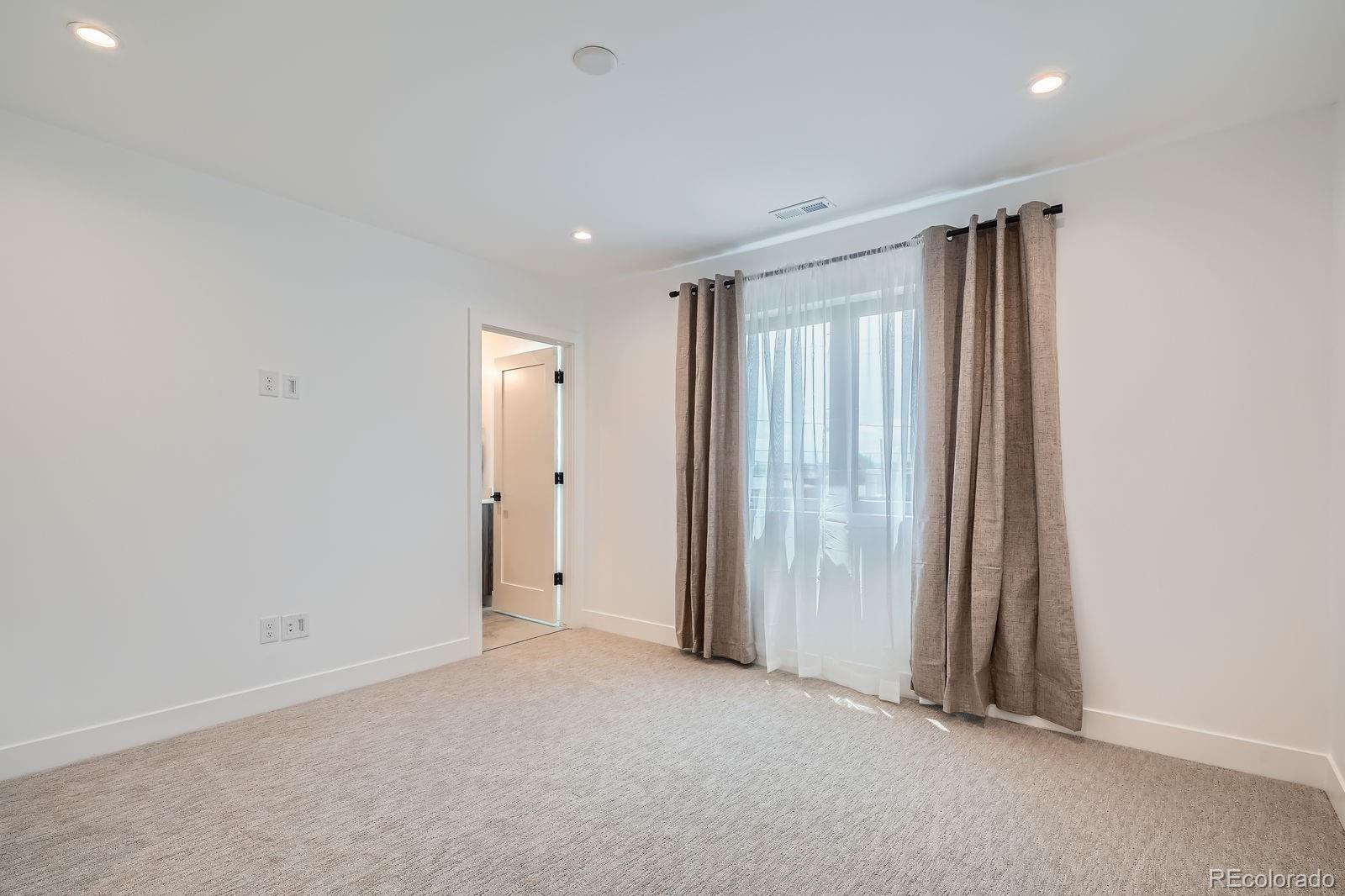 4474 Utica Street Denver, CO 80212 - Photo 23 of 40 an empty room with windows