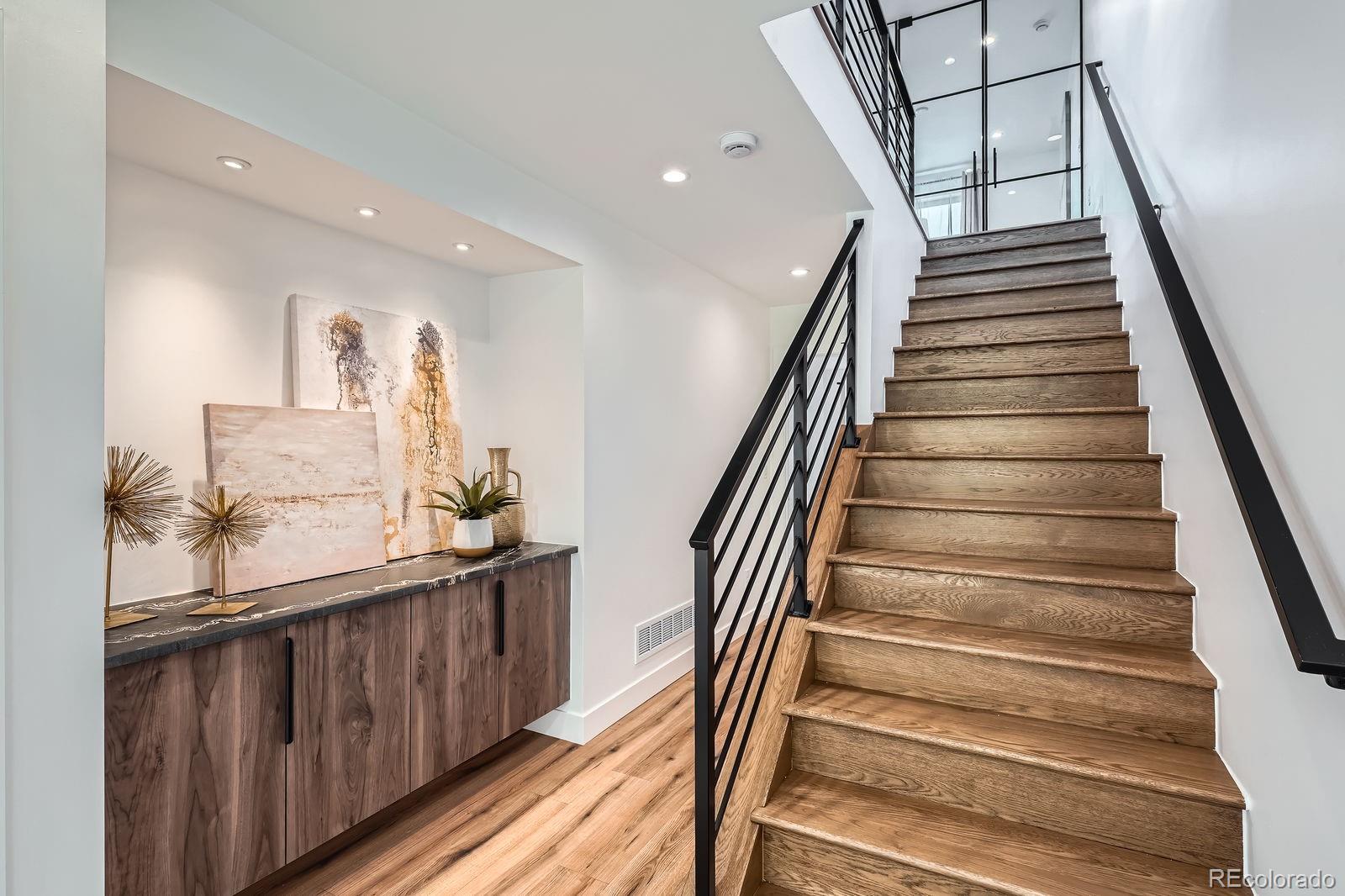 4474 Utica Street Denver, CO 80212 - Photo 29 of 43 a view of entryway and hall with wooden floor