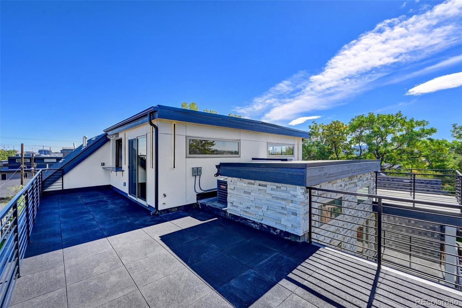 4474 Utica Street Denver, CO 80212 - Photo 33 of 40 a view of house with backyard and deck