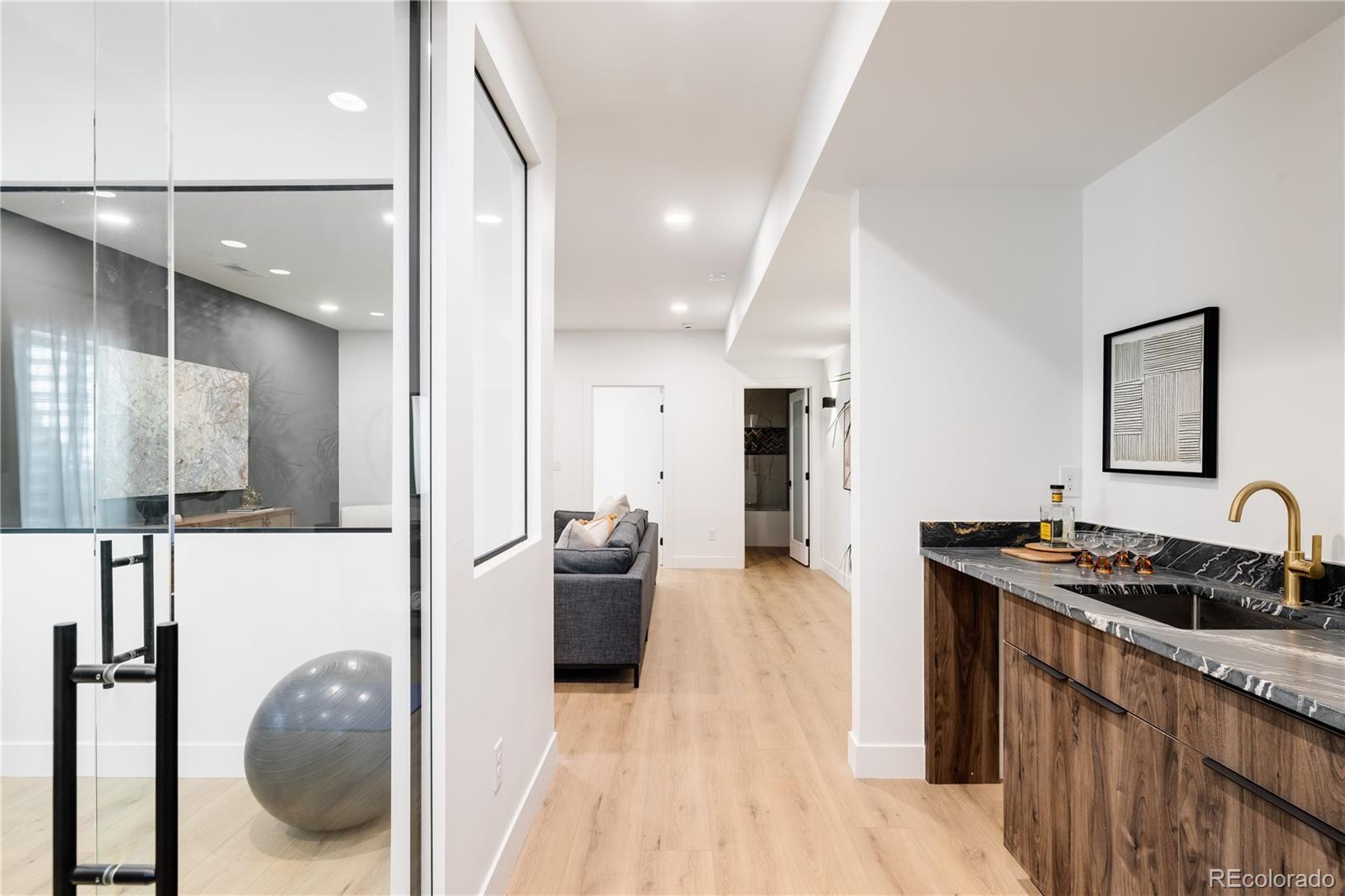 4474 Utica Street Denver, CO 80212 - Photo 35 of 40 a kitchen with sink refrigerator and stove