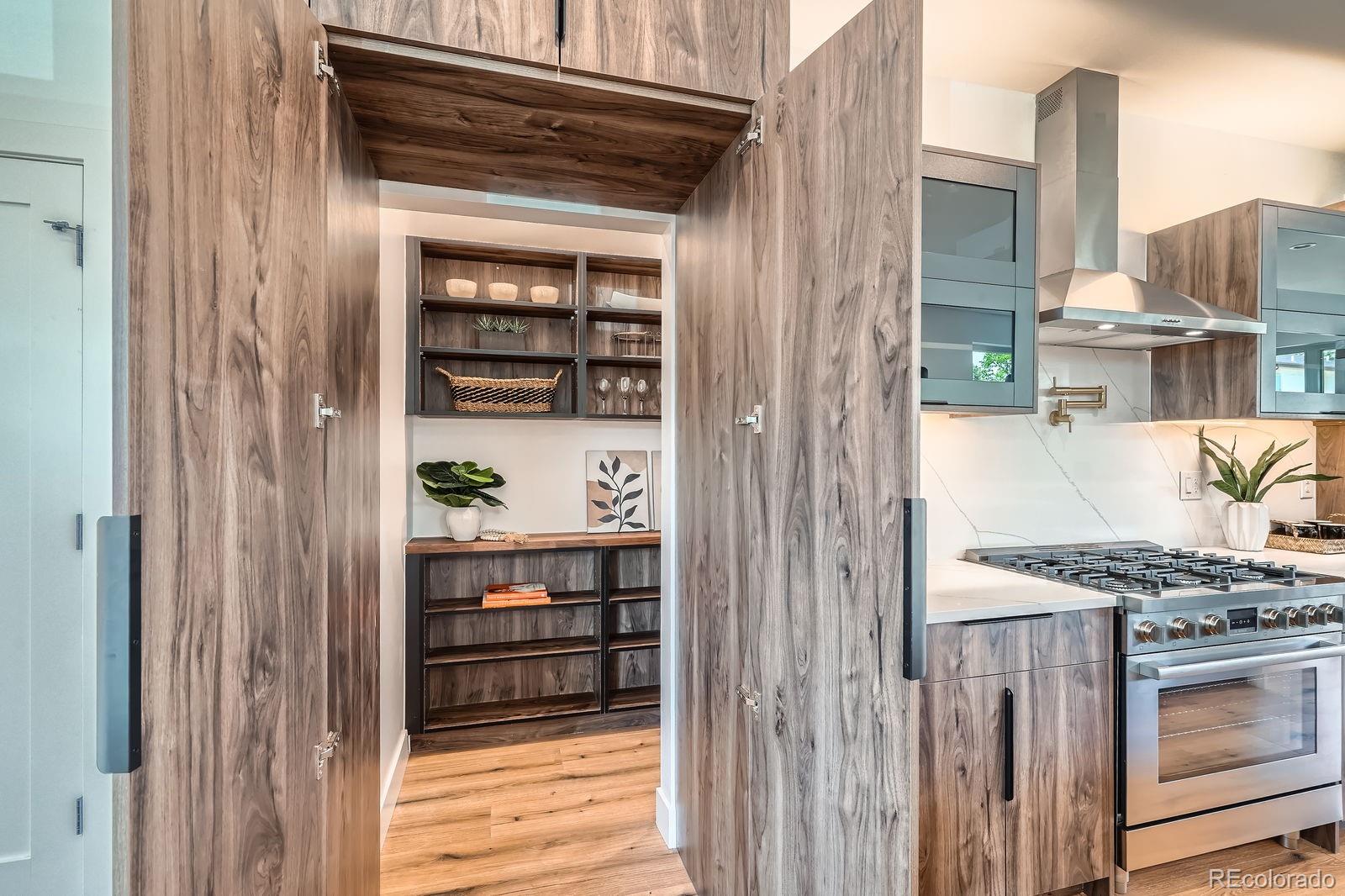 4474 Utica Street Denver, CO 80212 - Photo 8 of 40 a kitchen with a stove and a refrigerator