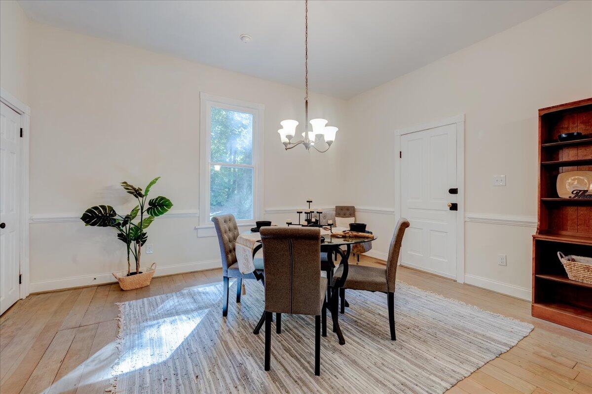 4534 Main Street Drakes Branch, VA 23937 - Photo 14 of 36 a view of a dining room with furniture and wooden floor