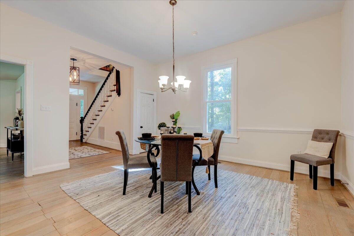 4534 Main Street Drakes Branch, VA 23937 - Photo 17 of 36 a view of a dining room with furniture window and wooden floor